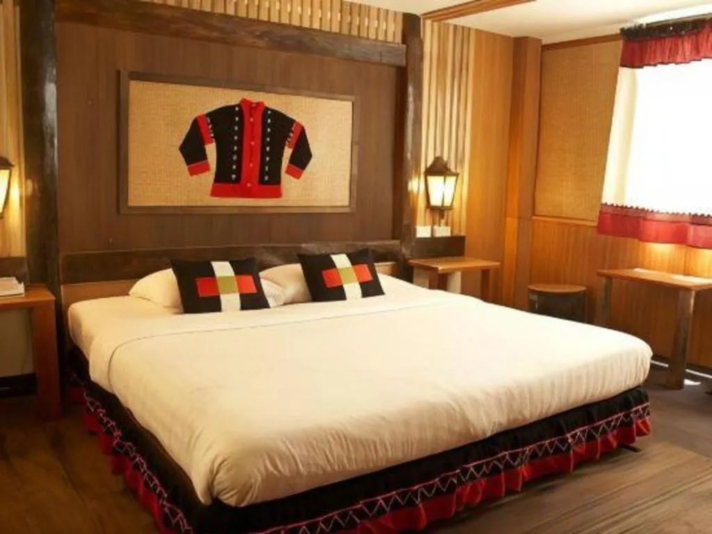 Bed in Phumanee Home Hotel