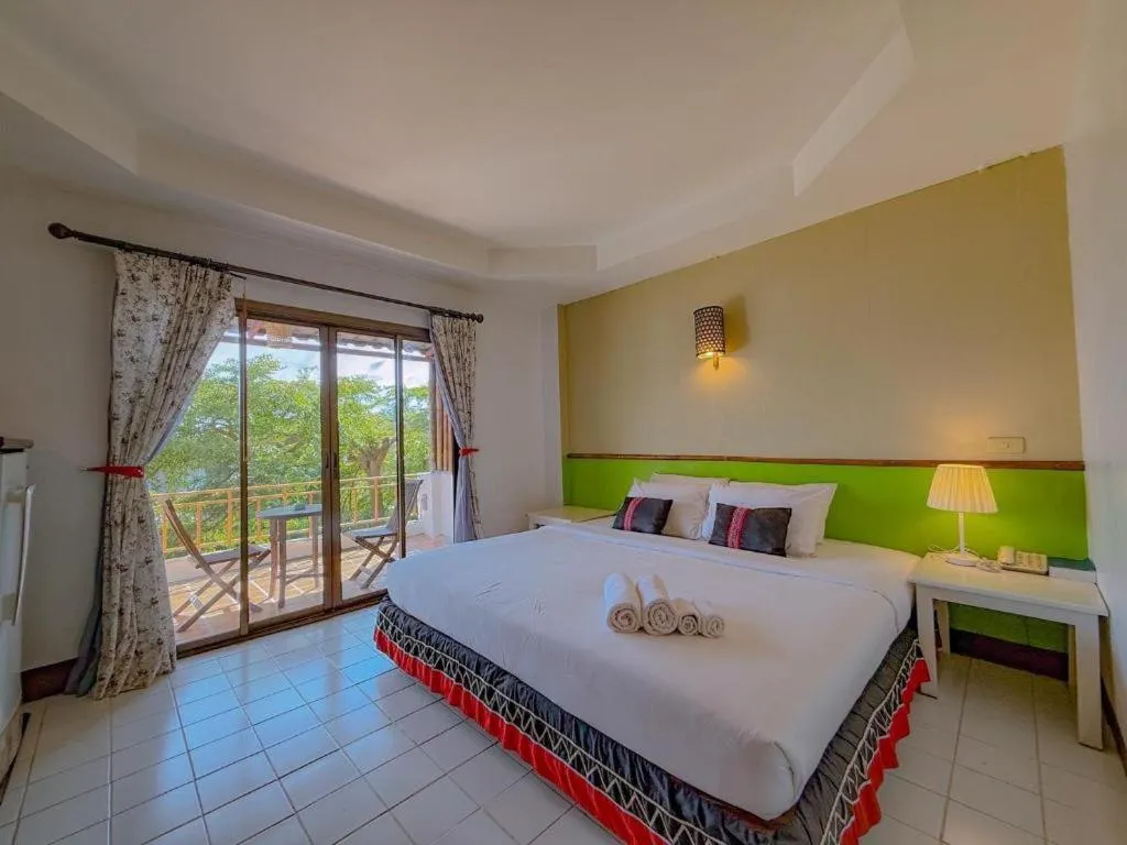 Bed in Phumanee Home Hotel