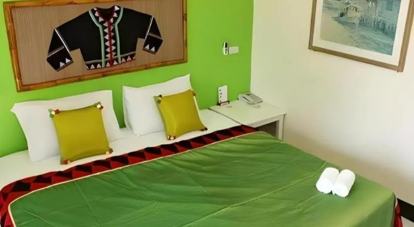 Bed in Phumanee Home Hotel