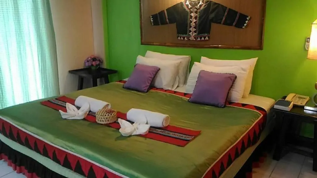 Bed in Phumanee Home Hotel