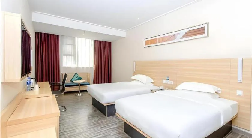 Bed in City Comfort Inn Jiangmen Xinhui Xiangshan Park