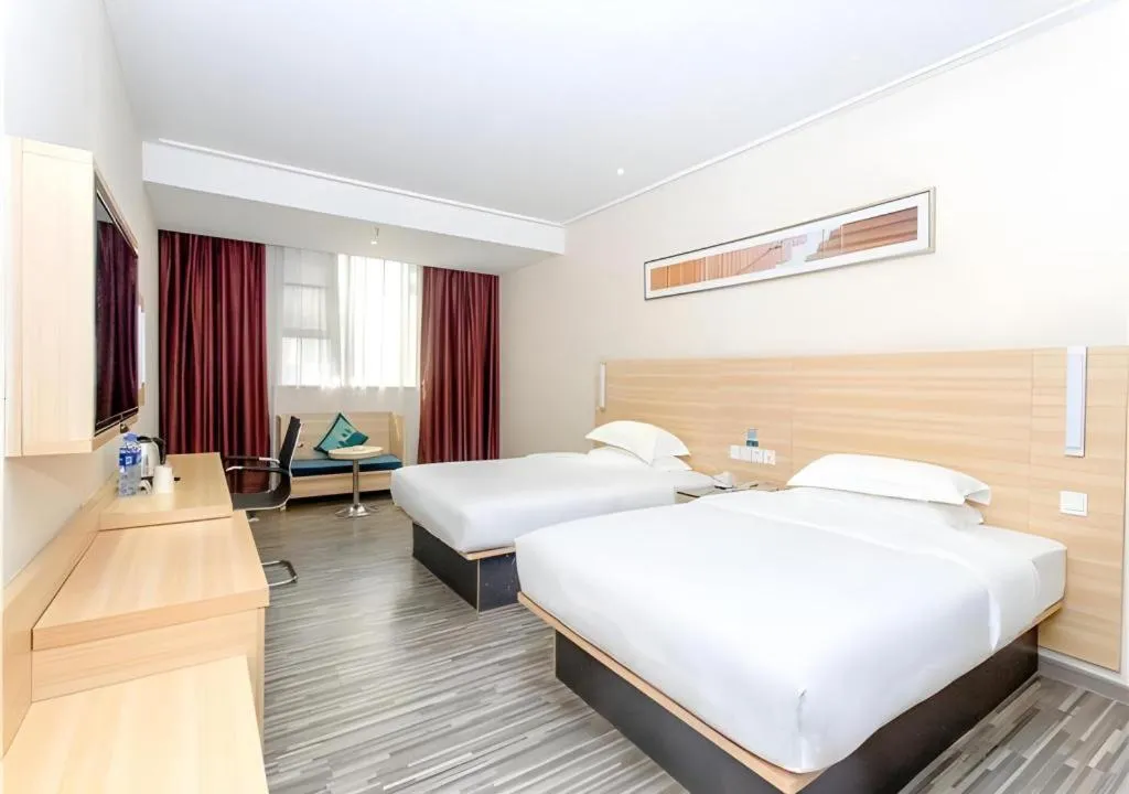 Bed in City Comfort Inn Jiangmen Xinhui Xiangshan Park