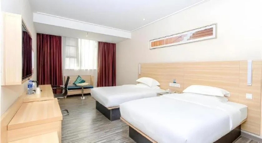 Bed in City Comfort Inn Jiangmen Xinhui Xiangshan Park