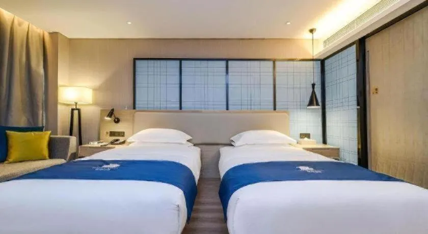 Bed in Echarm Hotel Guiyang International Convention & Exhibition Center