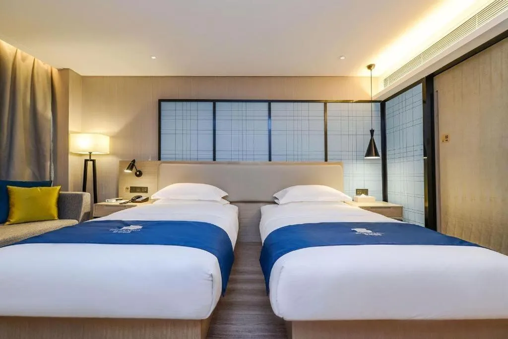 Bed in Echarm Hotel Guiyang International Convention & Exhibition Center