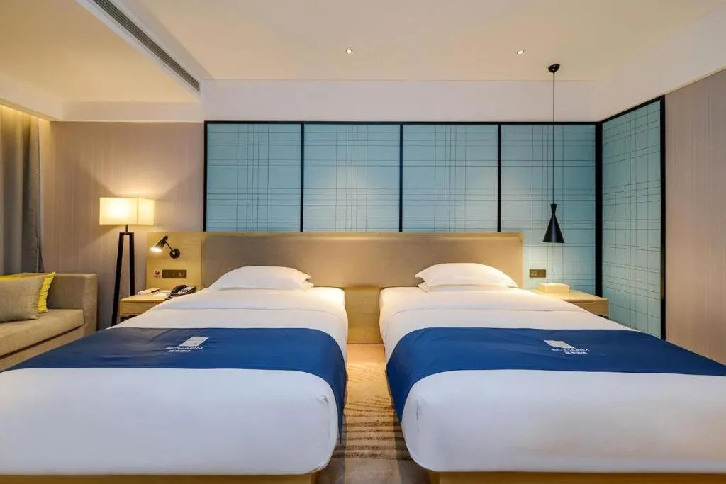 Bed in Echarm Hotel Guiyang International Convention & Exhibition Center