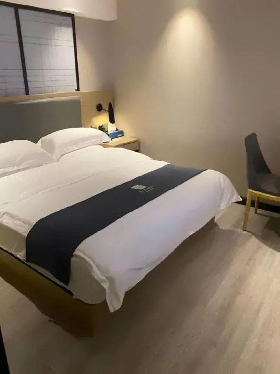 Bed in Echarm Hotel Guiyang International Convention & Exhibition Center