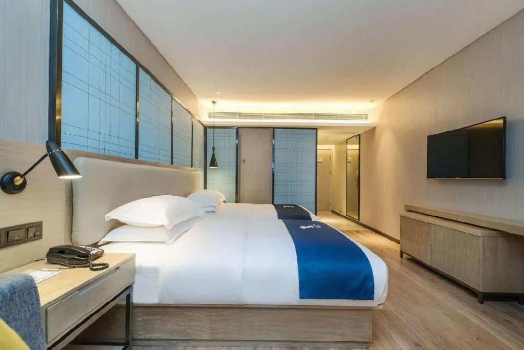 Bed in Echarm Hotel Guiyang International Convention & Exhibition Center