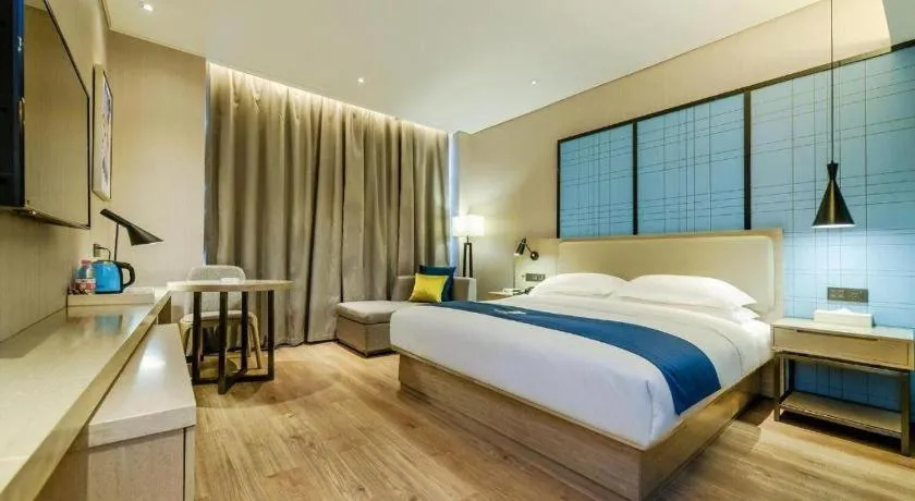 Bed in Echarm Hotel Guiyang International Convention & Exhibition Center