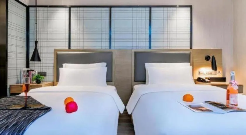 Bed in Echarm Hotel Guiyang International Convention & Exhibition Center