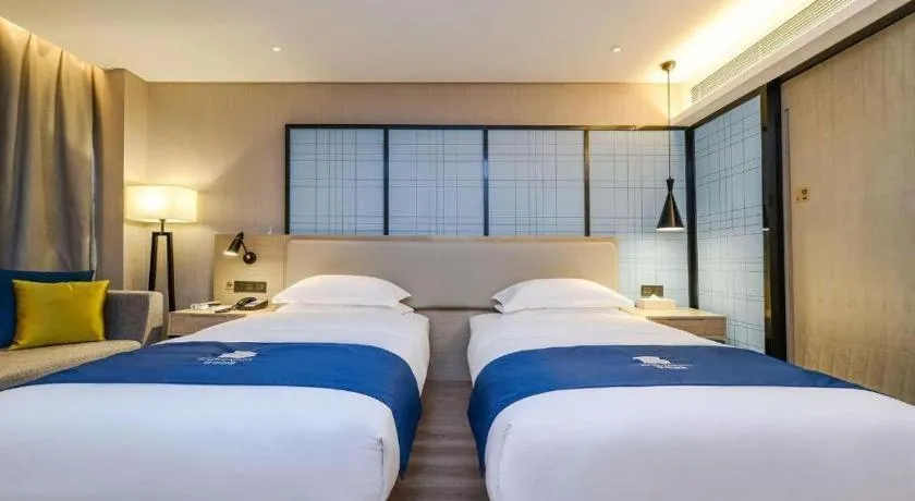Bed in Echarm Hotel Guiyang International Convention & Exhibition Center