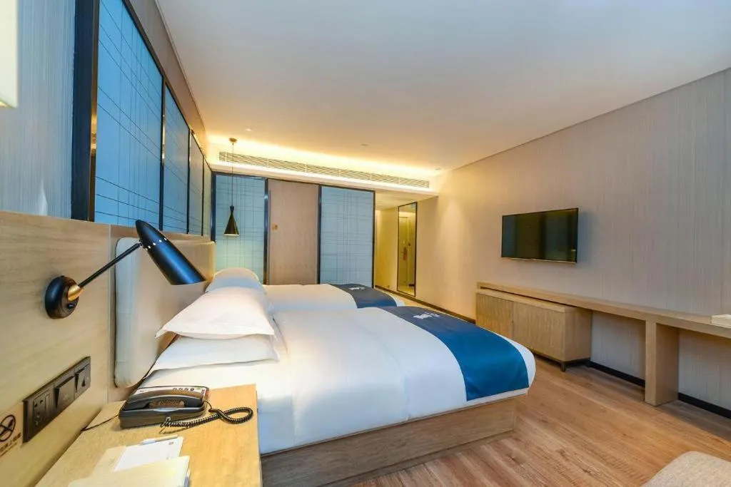 Bed in Echarm Hotel Guiyang International Convention & Exhibition Center