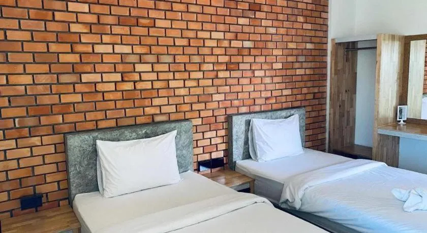 Bed in Nata Resort Chanthaburi II