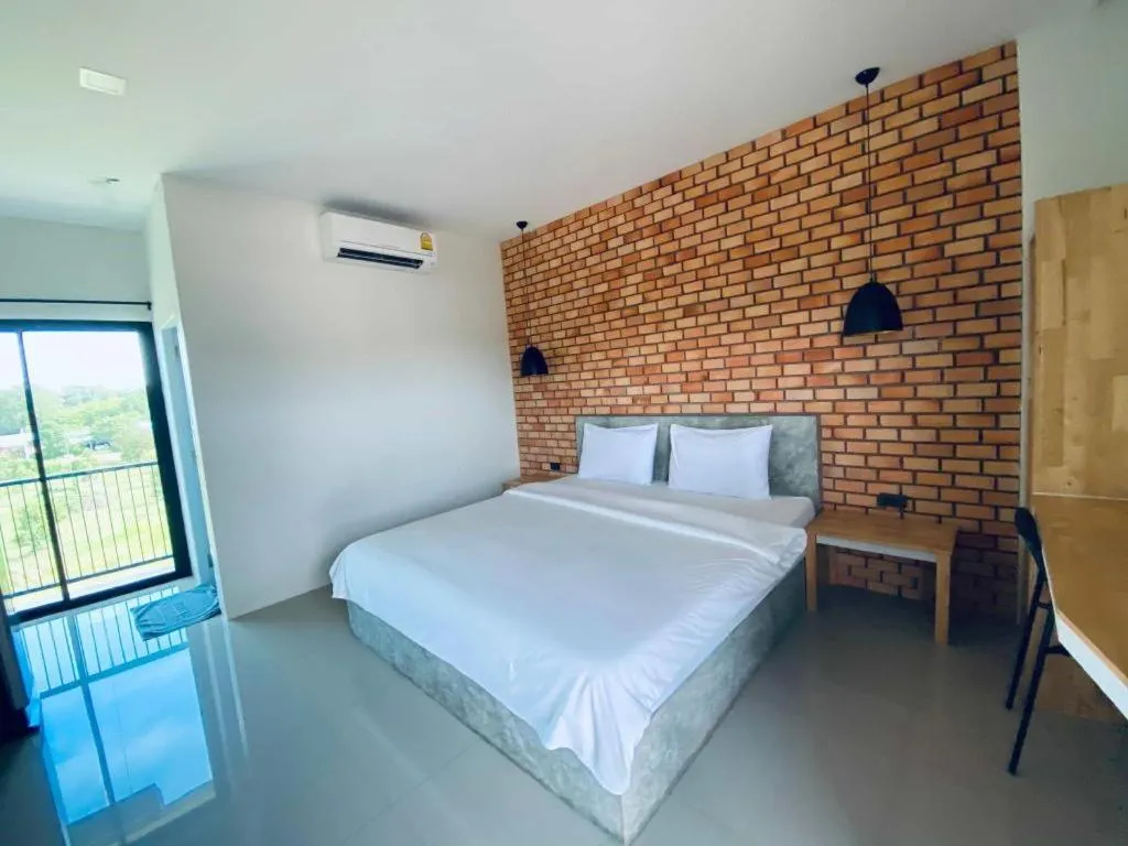 Bed in Nata Resort Chanthaburi II