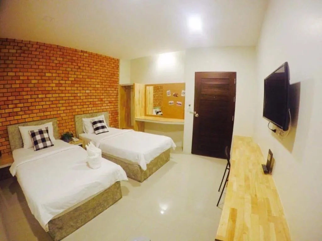 Bed in Nata Resort Chanthaburi II