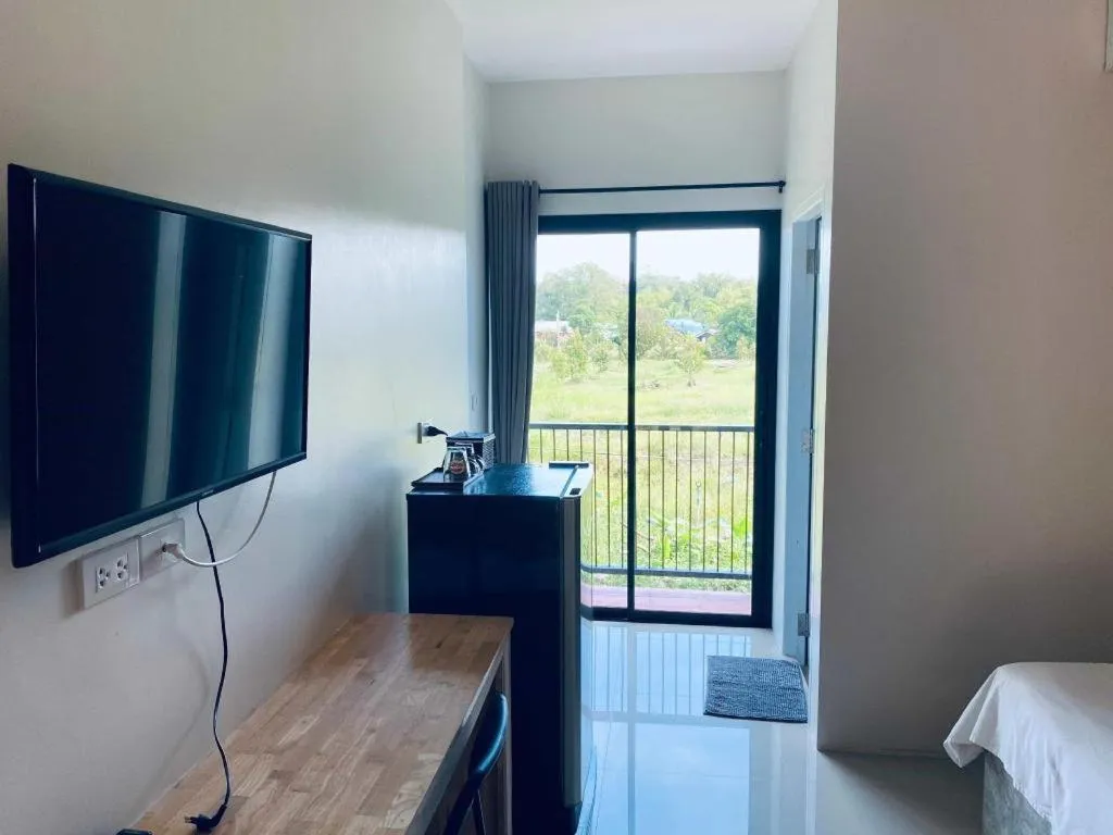 Bed in Nata Resort Chanthaburi II