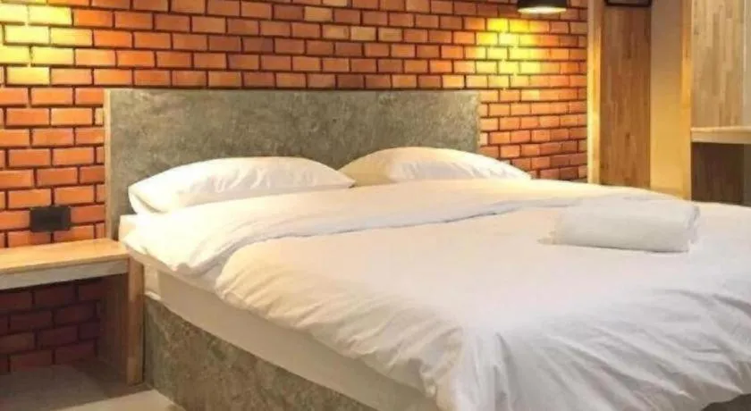 Bed in Nata Resort Chanthaburi II