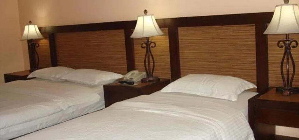 Bed in Planta Centro Bacolod Hotel & Residences