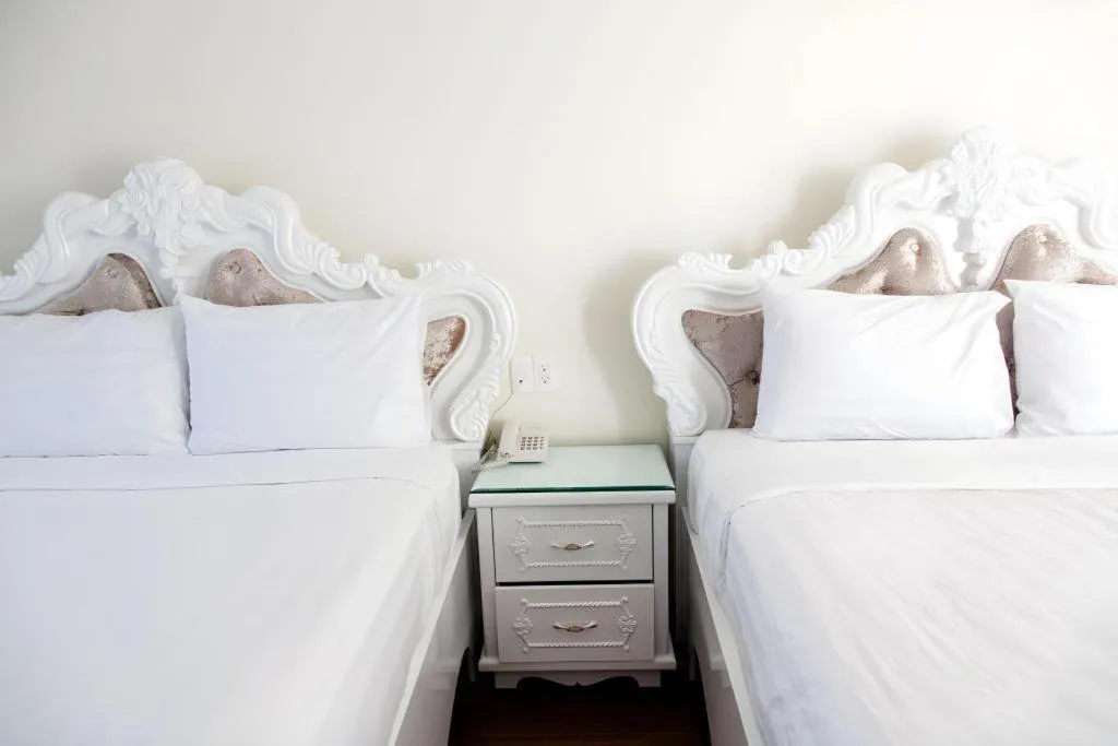 Bed in Hoa Sen Vang Hotel Dalat