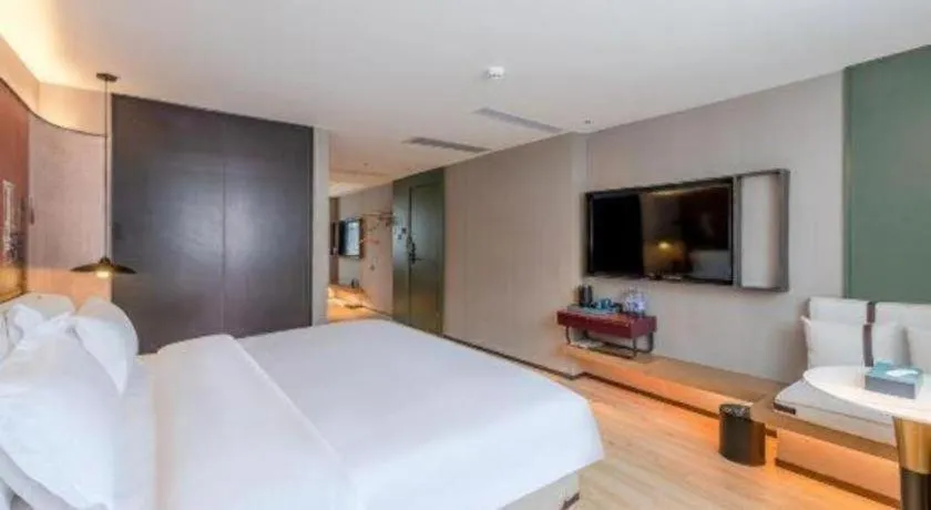 Bed in Bravo Business Hotel