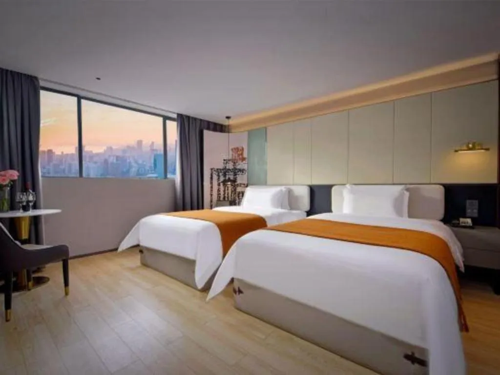 Bed in Bravo Business Hotel
