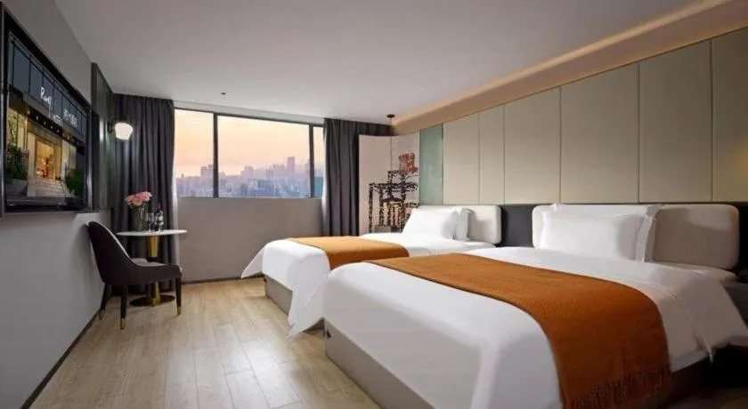 Bed in Bravo Business Hotel