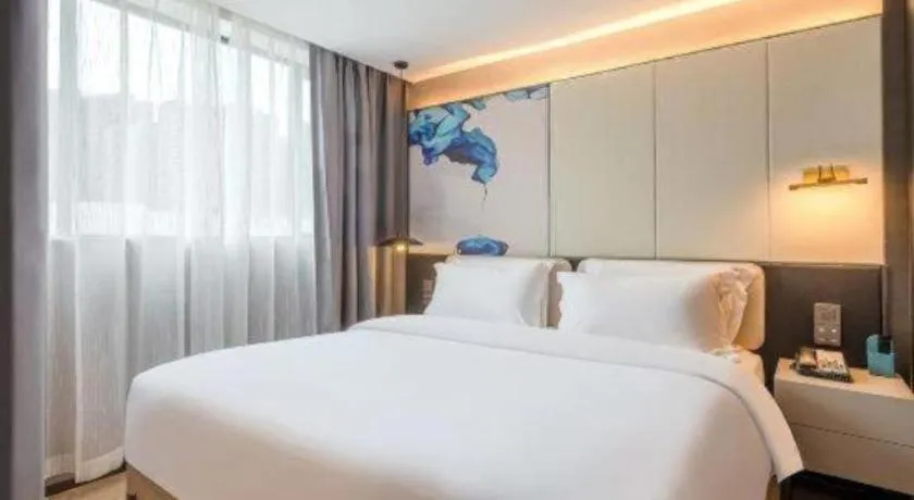 Bed in Bravo Business Hotel