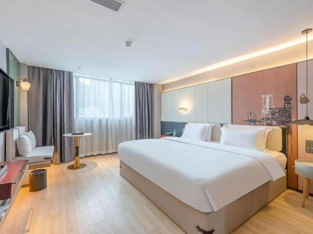 Bed in Bravo Business Hotel