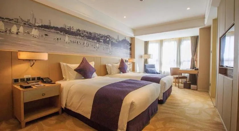 Bed in Sky World Hotel Qingdao