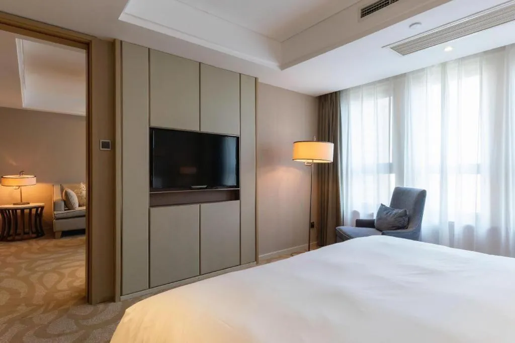 Bed in Sky World Hotel Qingdao