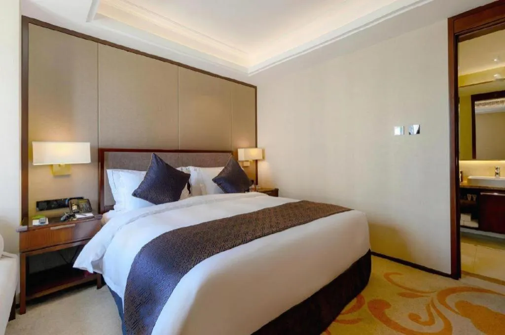 Bed in Sky World Hotel Qingdao