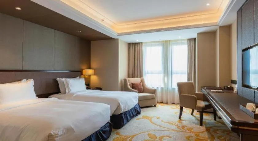 Bed in Sky World Hotel Qingdao