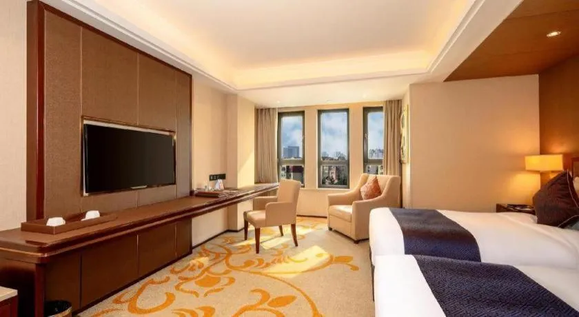 Bed in Sky World Hotel Qingdao