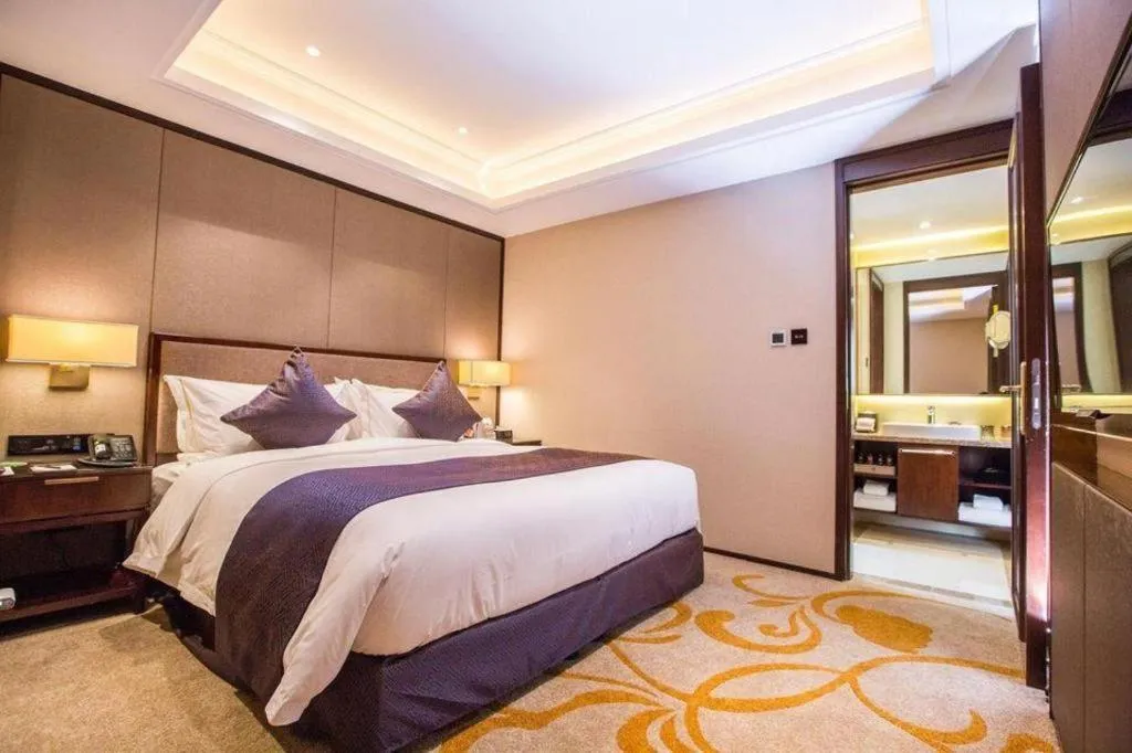 Bed in Sky World Hotel Qingdao