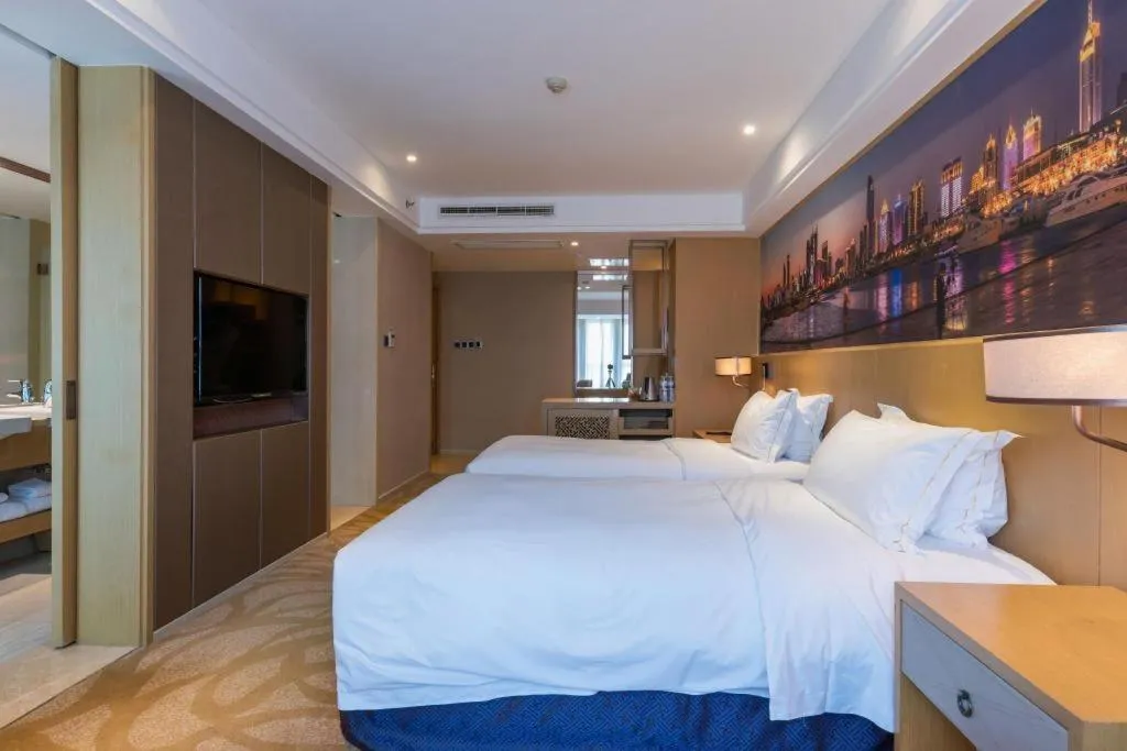 Bed in Sky World Hotel Qingdao