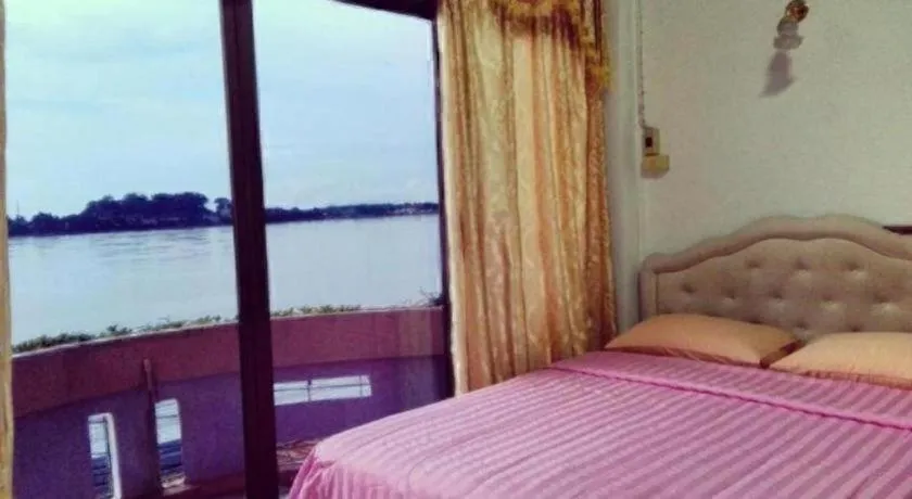 Bed in Just Mansion Hotel