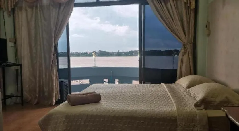 Bed in Just Mansion Hotel