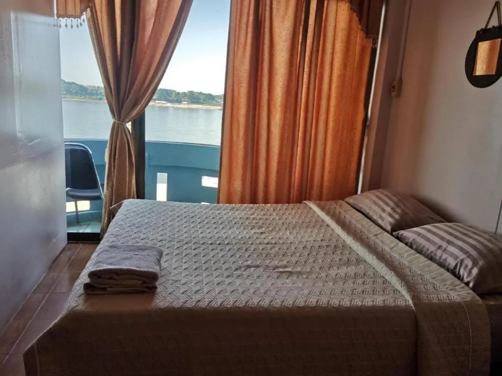 Bed in Just Mansion Hotel