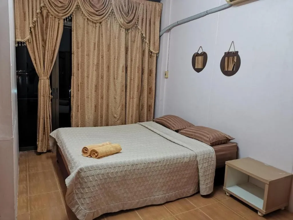 Bed in Just Mansion Hotel