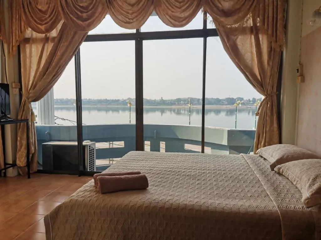 Bed in Just Mansion Hotel