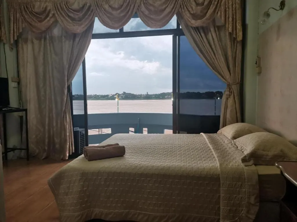 Bed in Just Mansion Hotel