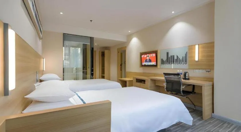 Bed in City Comfort Inn Huanggang Guibinlou Wanda Square