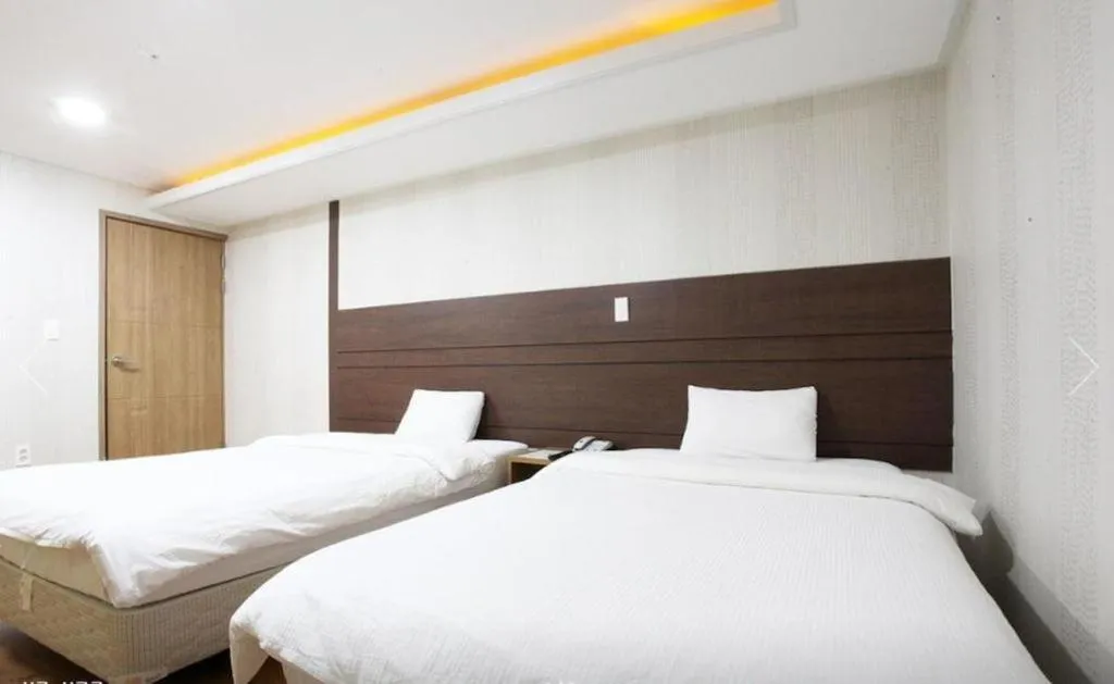 Bed in CJ Tourist Hotel