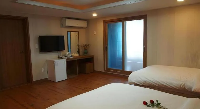 Bed in CJ Tourist Hotel