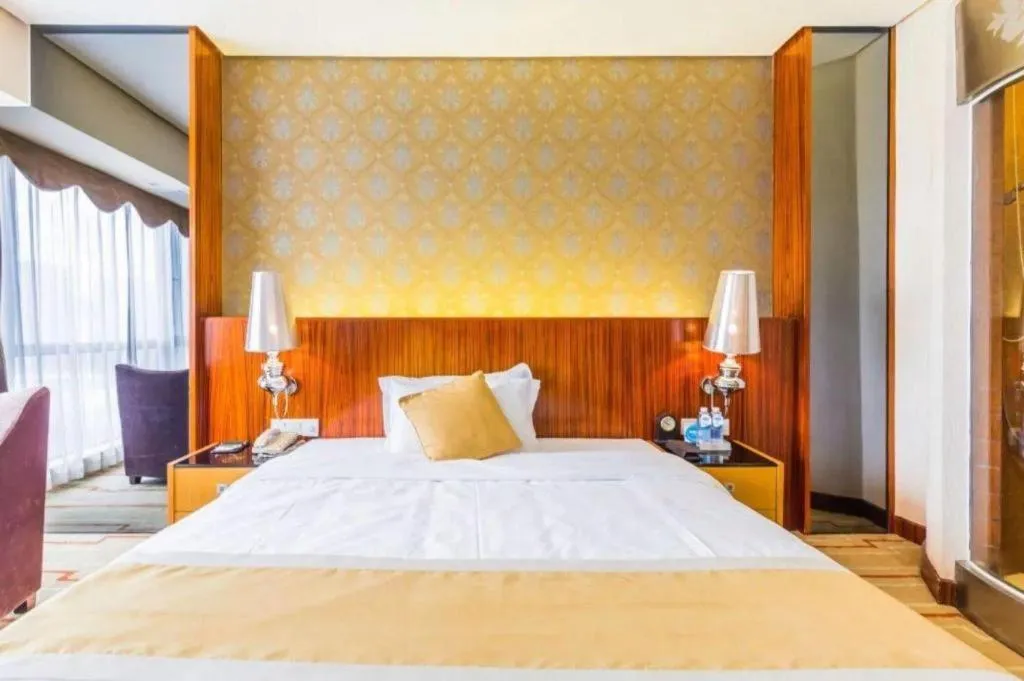 Bed in Foshan Nanhai Huifeng Holiday Hotel