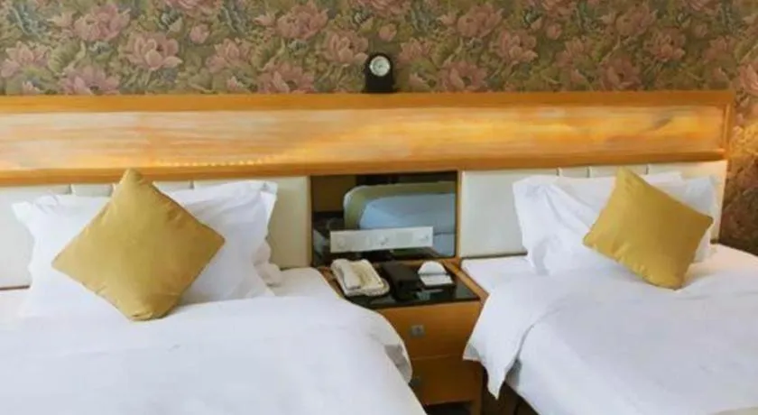 Bed in Foshan Nanhai Huifeng Holiday Hotel