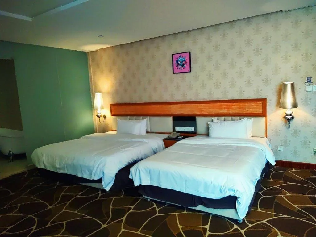 Bed in Foshan Nanhai Huifeng Holiday Hotel