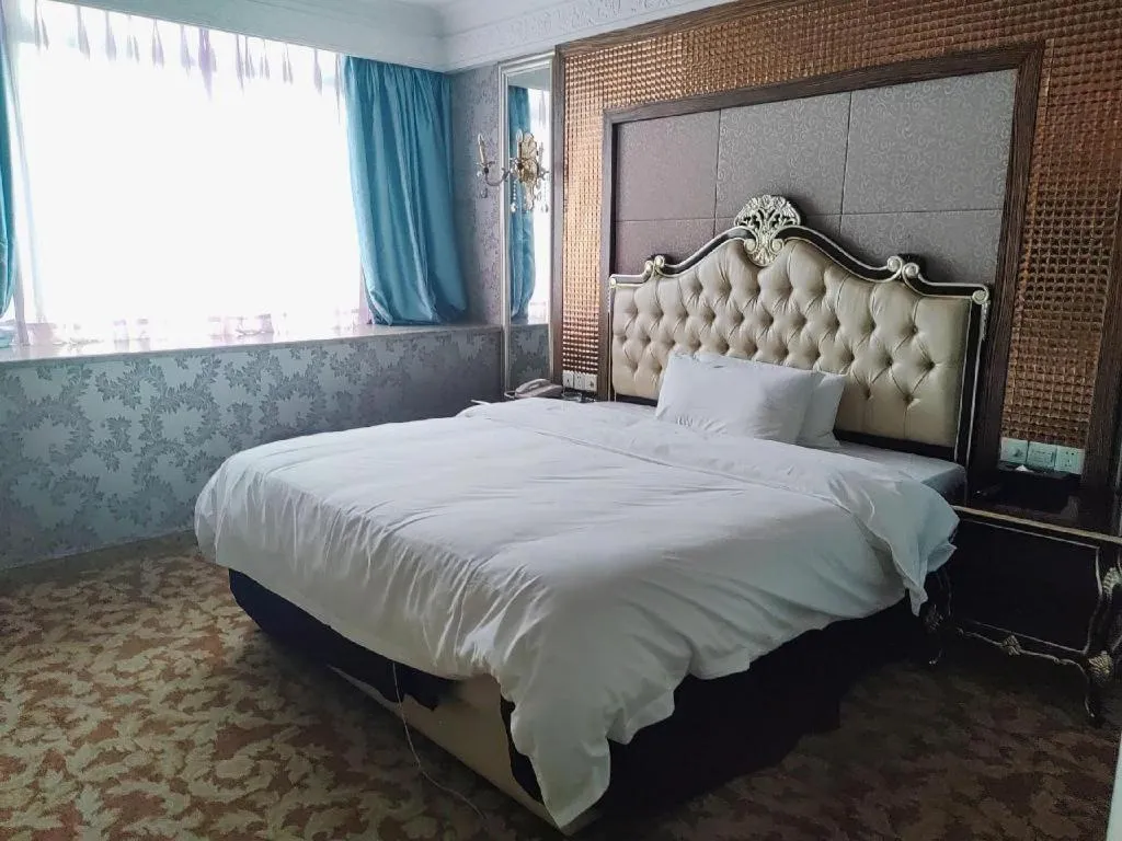 Bed in Foshan Nanhai Huifeng Holiday Hotel