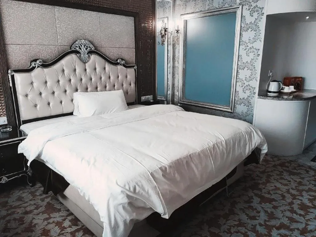 Bed in Foshan Nanhai Huifeng Holiday Hotel