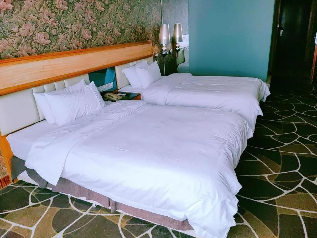 Bed in Foshan Nanhai Huifeng Holiday Hotel